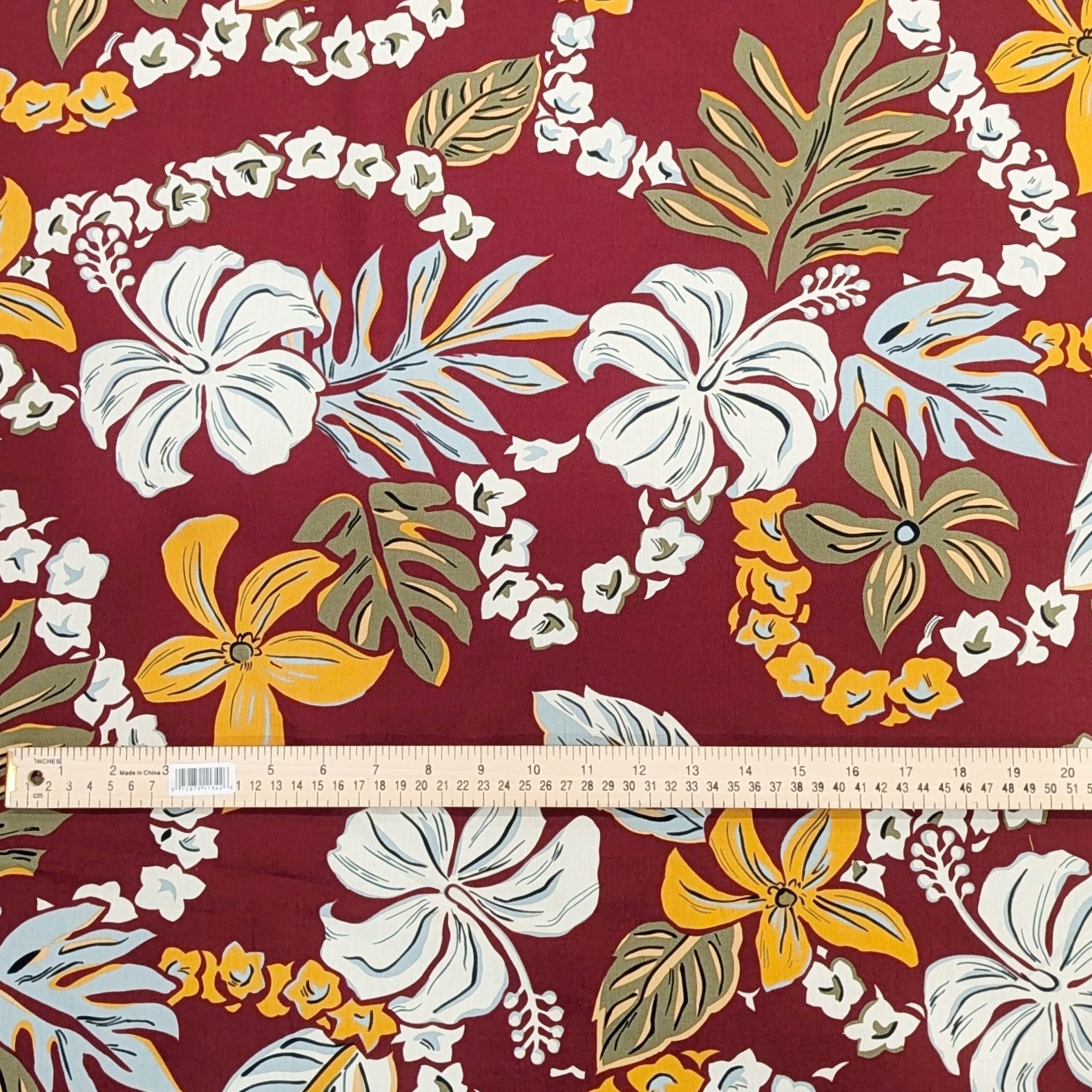 MaroonHawaiianFabricwithFlowerLei